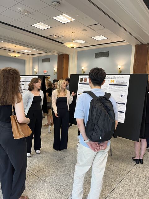McKenzie presenting the poster at the BDSI symposium